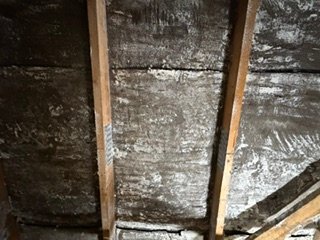 Roof timbers in a loft, from a spray foam removal job